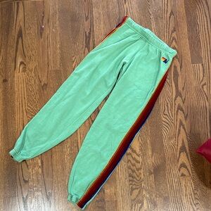 Aviator Nation green women’s sweatpants with velour Stripes